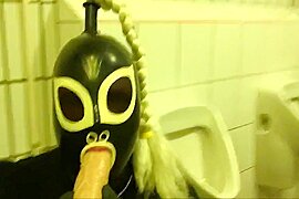 Rubberdoll Monique - Blowjob training in a public toilet - free porn video